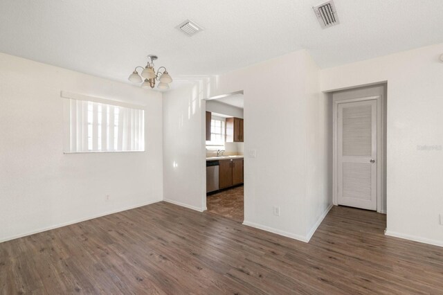 200 Country Club Dr Unit 906, Largo, FL 33771 - interior space with an inviting chandelier, dark wood finished floors, and visible vents
