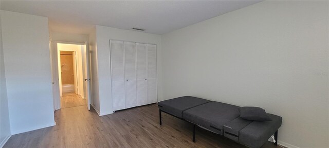 200 Country Club Dr Unit 906, Largo, FL 33771 - living area featuring baseboards, visible vents, and wood finished floors