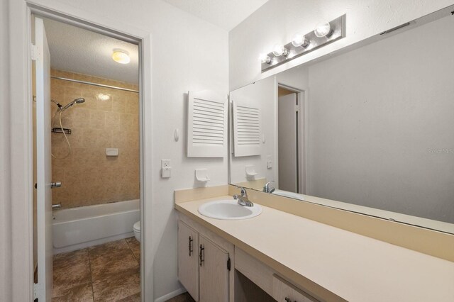 200 Country Club Dr Unit 906, Largo, FL 33771 - bathroom featuring vanity, tile patterned floors, toilet, and shower / washtub combination