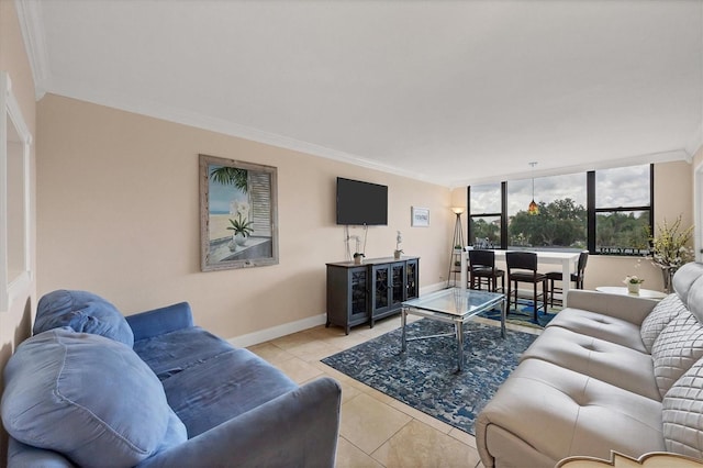 tiled living area with baseboards and ornamental molding