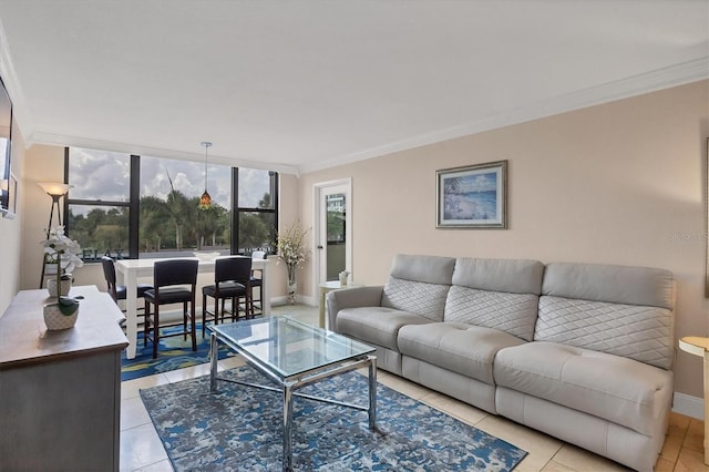 living area featuring crown molding, baseboards, and light tile patterned floors