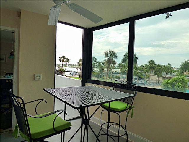 dining area featuring baseboards and ceiling fan
