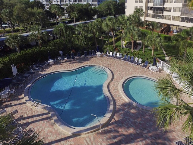 community pool with a patio area