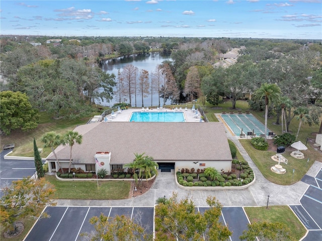 bird's eye view of a nearby body of water and a pool
