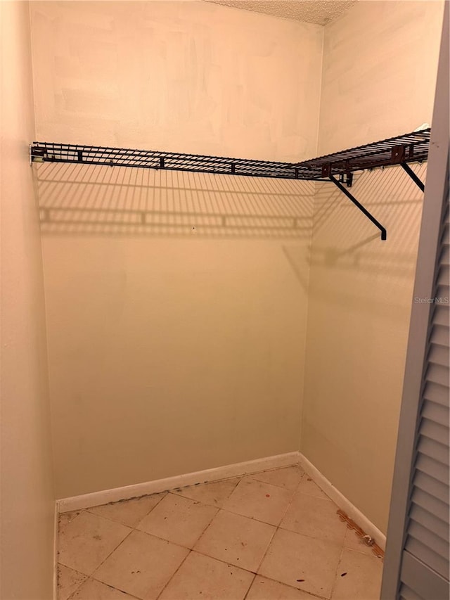 7360 Ulmerton Rd Unit 20F, Largo, FL 33771 - walk in closet with light tile patterned flooring