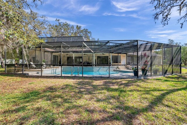 6514 Sunhigh Dr, New Port Richey, FL 34655 - outdoor pool featuring a lawn, a lanai, and a patio area