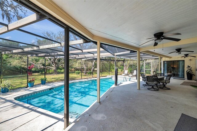 6514 Sunhigh Dr, New Port Richey, FL 34655 - swimming pool with a patio area, a ceiling fan, a lanai, and outdoor dining area