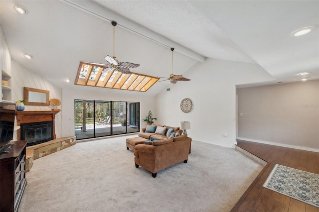 6514 Sunhigh Dr, New Port Richey, FL 34655 - living room with a large fireplace, beam ceiling, a ceiling fan, wood finished floors, and recessed lighting