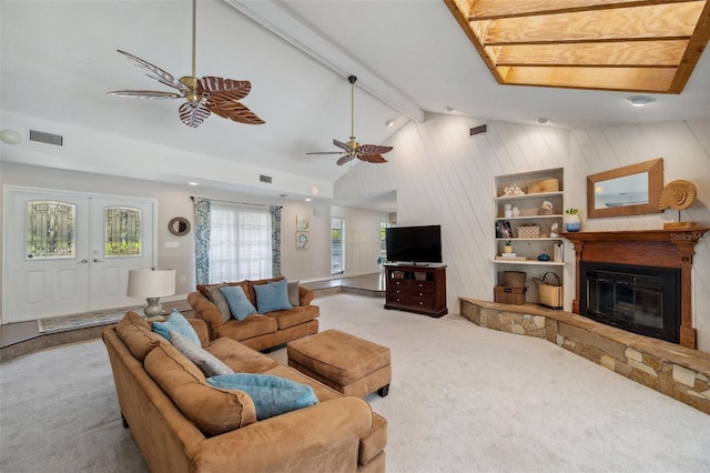 6514 Sunhigh Dr, New Port Richey, FL 34655 - carpeted living room featuring a glass covered fireplace, a ceiling fan, and wood walls