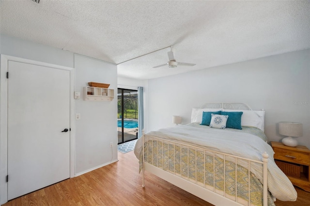 6514 Sunhigh Dr, New Port Richey, FL 34655 - bedroom with wood finished floors, access to outside, a textured ceiling, and a ceiling fan