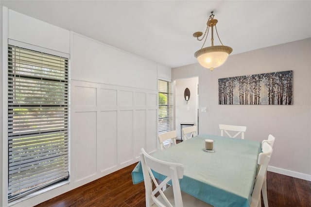 6514 Sunhigh Dr, New Port Richey, FL 34655 - dining area featuring dark wood-style floors