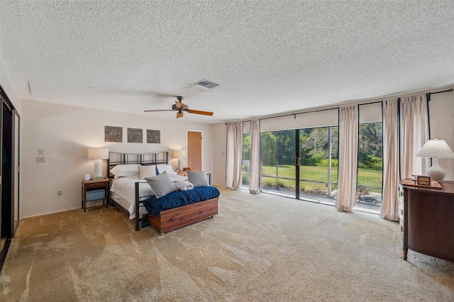 6514 Sunhigh Dr, New Port Richey, FL 34655 - carpeted bedroom featuring access to exterior, a textured ceiling, ceiling fan, and baseboards