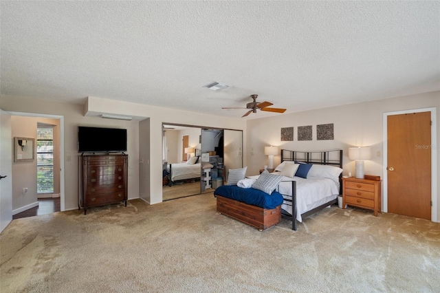 6514 Sunhigh Dr, New Port Richey, FL 34655 - carpeted bedroom with a textured ceiling and ceiling fan