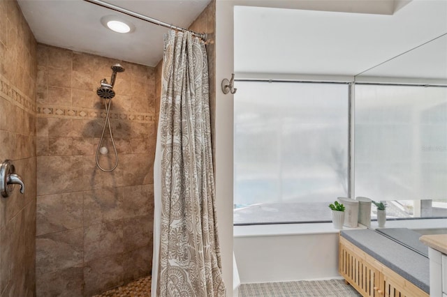 6514 Sunhigh Dr, New Port Richey, FL 34655 - bathroom with a tile shower, tile patterned floors, and vanity