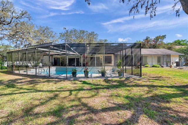 6514 Sunhigh Dr, New Port Richey, FL 34655 - rear view of property with central AC unit, an outdoor pool, a lawn, and glass enclosure