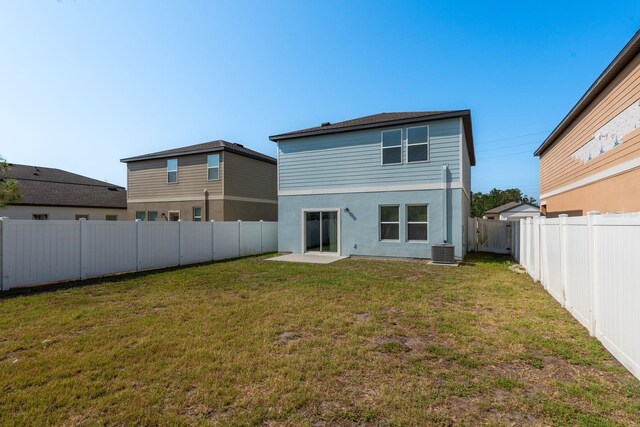back of house featuring cooling unit and stucco siding