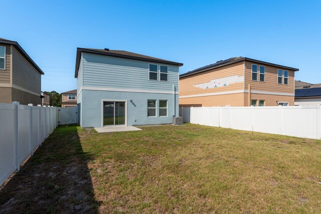 rear view of property featuring cooling unit and stucco siding