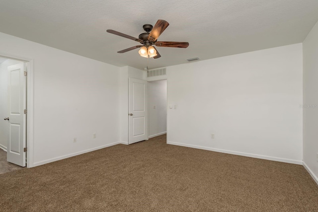 empty room featuring carpet floors, a ceiling fan, and baseboards