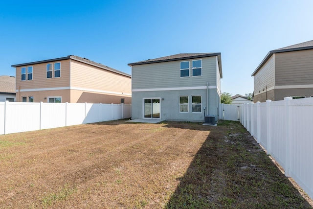 rear view of house featuring cooling unit and stucco siding