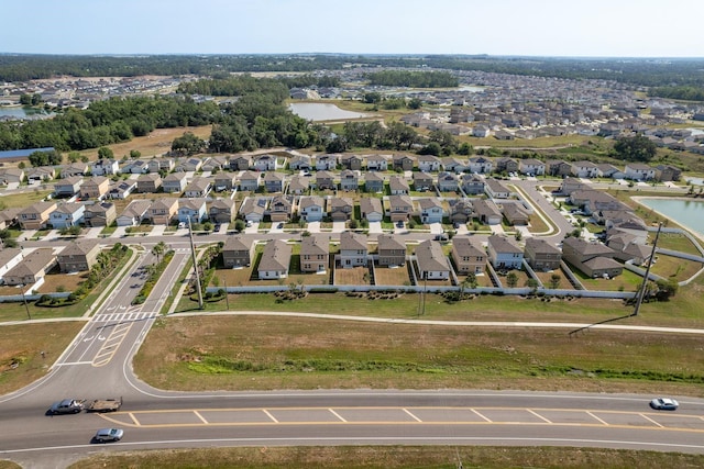 aerial perspective of suburban area featuring a nearby body of water