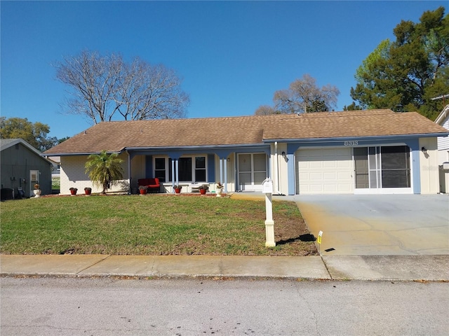 8313 Cavalry Dr, Hudson, FL 34667 - ranch-style home with an attached garage, a porch, a front yard, cooling unit, and concrete driveway