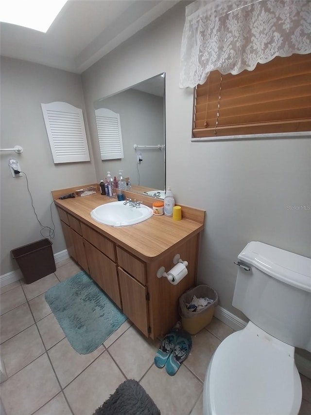 8313 Cavalry Dr, Hudson, FL 34667 - half bathroom with tile patterned flooring, baseboards, toilet, and vanity