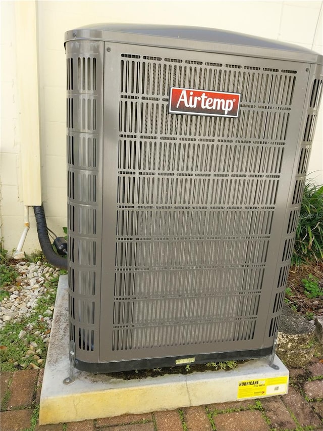 8313 Cavalry Dr, Hudson, FL 34667 - details featuring concrete block siding and central AC unit
