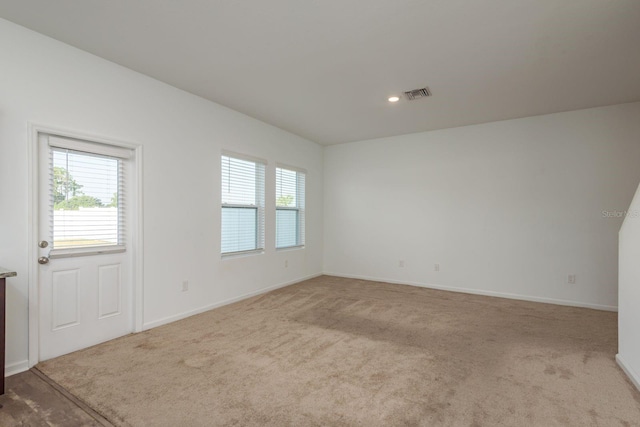 carpeted spare room with baseboards and recessed lighting