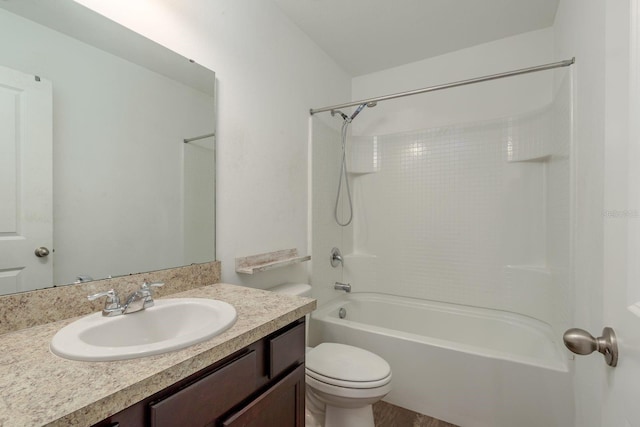 bathroom with toilet, vanity, and shower / tub combination