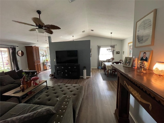 living room featuring a healthy amount of sunlight, a ceiling fan, wood finished floors, and lofted ceiling