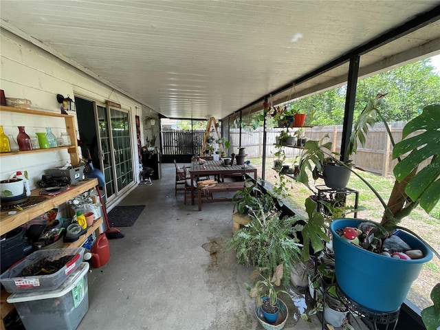 sunroom featuring outdoor dining area
