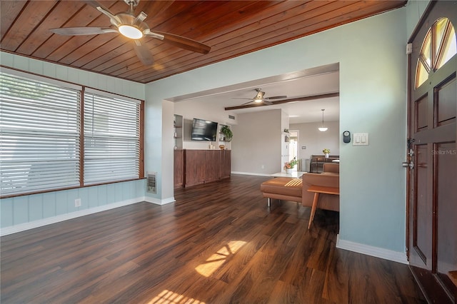 foyer featuring baseboards, a ceiling fan, and dark wood finished floors
