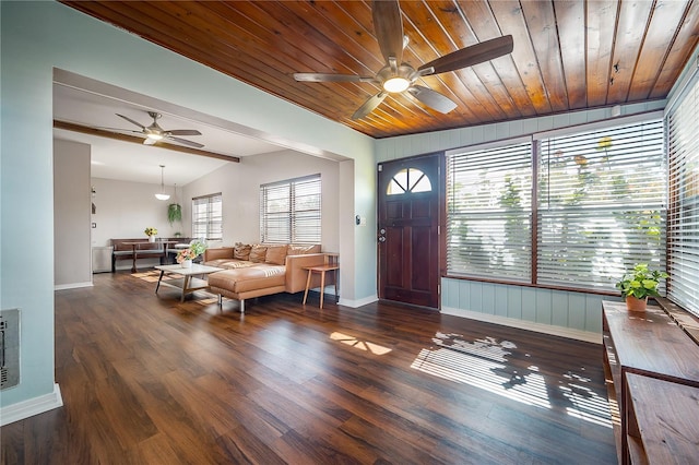 foyer entrance featuring a ceiling fan, baseboards, wood finished floors, and lofted ceiling