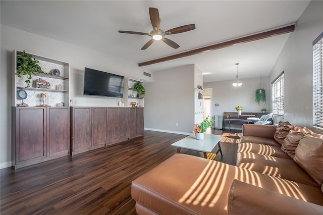 living room with ceiling fan, lofted ceiling with beams, baseboards, dark wood-type flooring, and visible vents