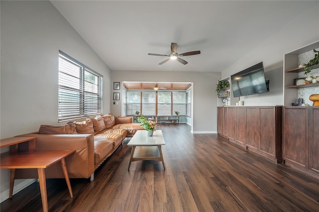 living room featuring baseboards, a ceiling fan, dark wood finished floors, and a healthy amount of sunlight