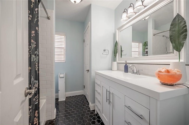 full bath featuring a healthy amount of sunlight, vanity, tile patterned floors, and shower / tub combo with curtain