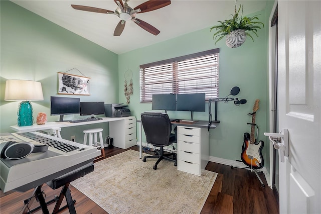 office area featuring dark wood-style flooring, ceiling fan, and baseboards