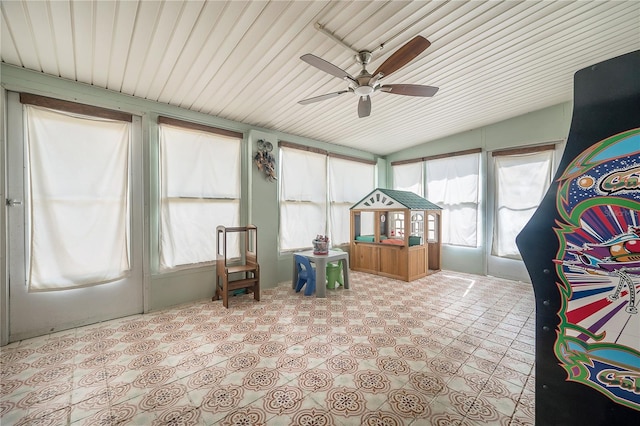 sunroom / solarium featuring vaulted ceiling