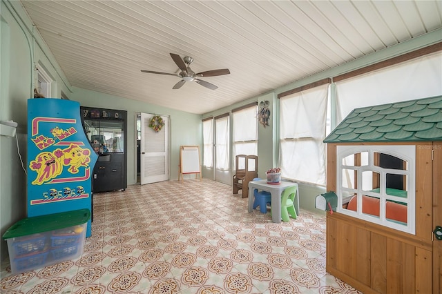 recreation room featuring a ceiling fan, wood ceiling, and vaulted ceiling