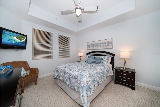 17735 Gulf Blvd Unit 304, Redington Shores, FL 33708 - bedroom with a raised ceiling, carpet, baseboards, and ceiling fan