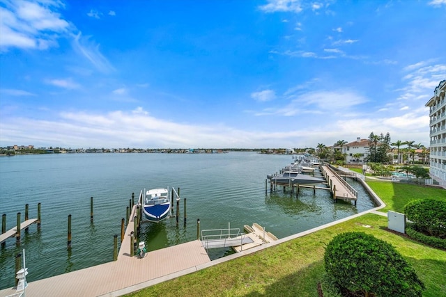 17735 Gulf Blvd Unit 304, Redington Shores, FL 33708 - dock featuring a water view, boat lift, and a lawn