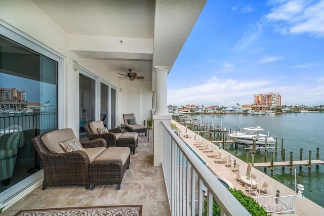 17735 Gulf Blvd Unit 304, Redington Shores, FL 33708 - balcony featuring a water view, ceiling fan, and a dock