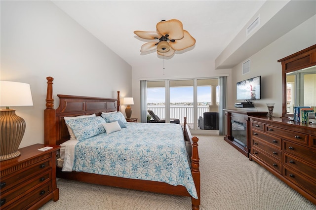 17735 Gulf Blvd Unit 304, Redington Shores, FL 33708 - bedroom featuring access to exterior, light carpet, lofted ceiling, and ceiling fan