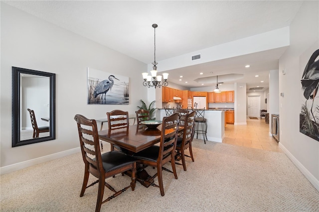 17735 Gulf Blvd Unit 304, Redington Shores, FL 33708 - dining room with light colored carpet, a chandelier, and recessed lighting