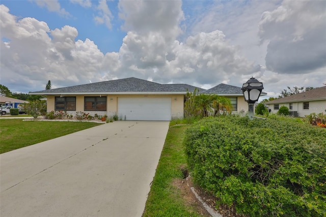 1915 W Del Webb Blvd, Sun City Center, FL 33573 - ranch-style house featuring driveway, a garage, stucco siding, and a front yard