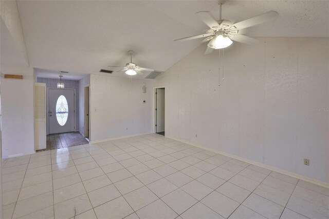 1915 W Del Webb Blvd, Sun City Center, FL 33573 - empty room with ceiling fan, light tile patterned floors, vaulted ceiling, and baseboards