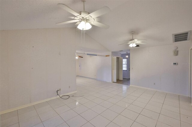 1915 W Del Webb Blvd, Sun City Center, FL 33573 - unfurnished room with ceiling fan, vaulted ceiling, light tile patterned flooring, baseboards, and a textured ceiling