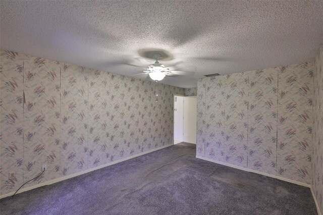 1915 W Del Webb Blvd, Sun City Center, FL 33573 - empty room featuring a ceiling fan, dark carpet, a textured ceiling, and wallpapered walls