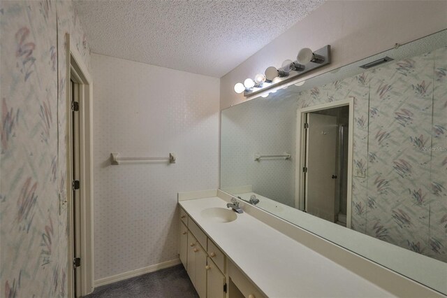 1915 W Del Webb Blvd, Sun City Center, FL 33573 - bathroom with vanity, a textured ceiling, and baseboards