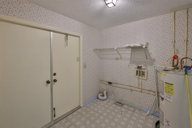 1915 W Del Webb Blvd, Sun City Center, FL 33573 - washroom with electric water heater, electric dryer hookup, wallpapered walls, a textured ceiling, and light flooring